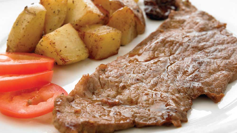 Rico bistec con papas aromáticas